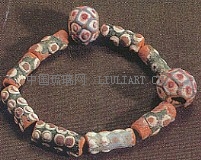 Tube-like and two round beads of the Warring States in the Museum of Hubei.jpg